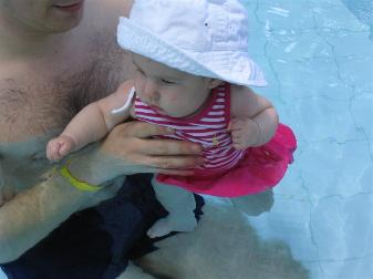 Finally in the pool.  She even went under a couple of times.  Hopefully she'll bee a fish like her Daddy.