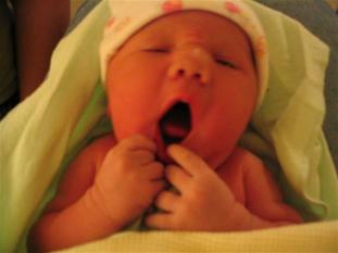 Holding her approximately one hour after birth.