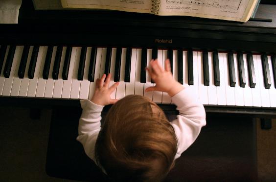 My Little One Plays Mozart...  Well, actually it's the primary songbook...  Well, actually she's really just banging on the keys.