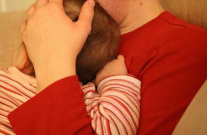 Laura comforting Audrey after a premature awakening.
