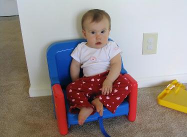 Before she had her hi-chair, Audrey had a booster seat.  I included this picture because it looks a lot like Laura in her baby pictures. 