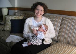 Laura feeding Audrey before church.  Grandma Flo should note the outfit this time!